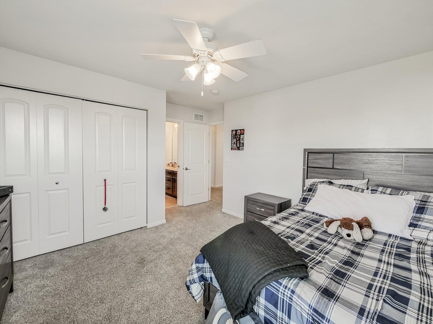 32 Catamaran Circle Pingree Grove, IL 60140 - Photo 30 of 46 a bedroom with a large bed and a ceiling fan