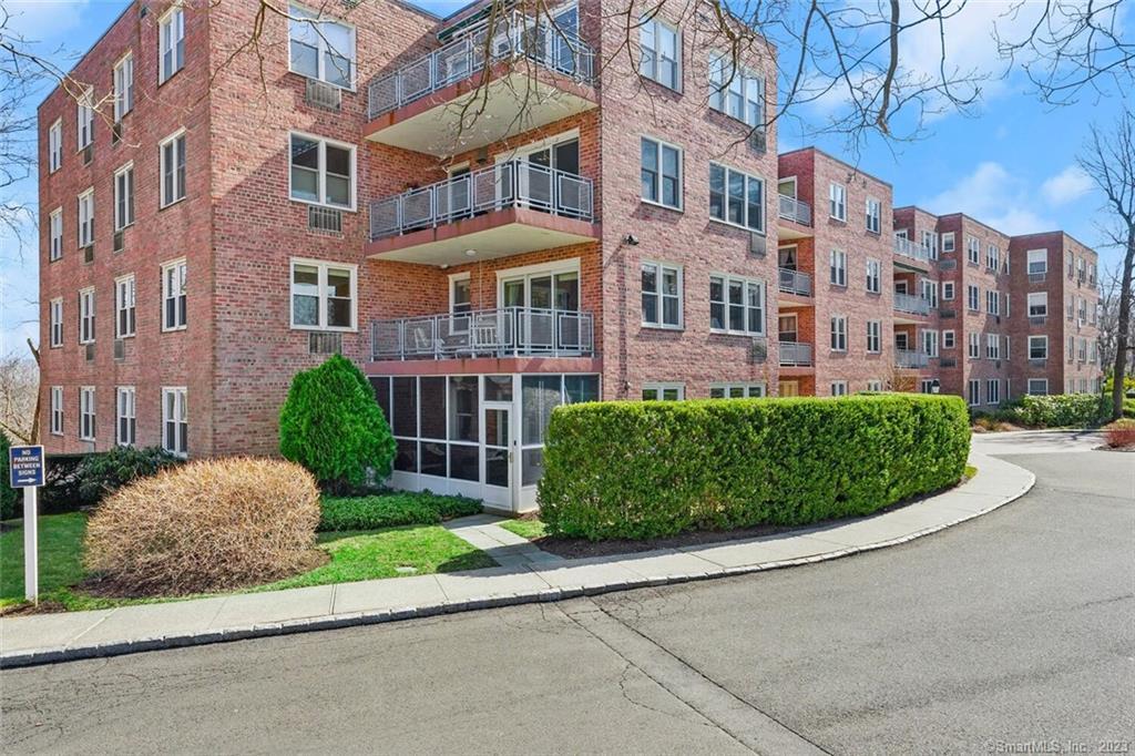 a view of a building with a yard