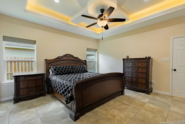a bedroom with a bed closet and dresser