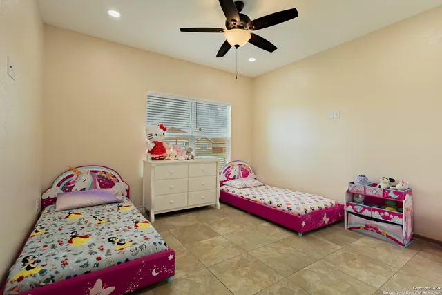 a bedroom with furniture and a window