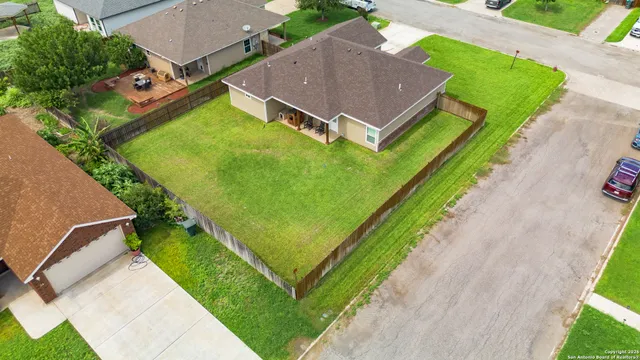 an aerial view of a house with a garden