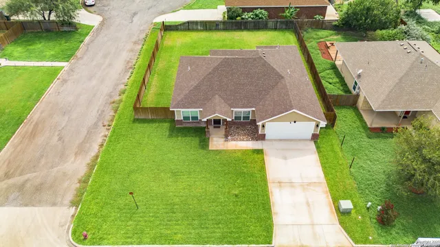 an aerial view of a house with a garden