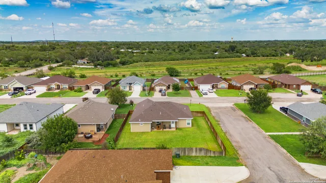 an aerial view of a house with a garden