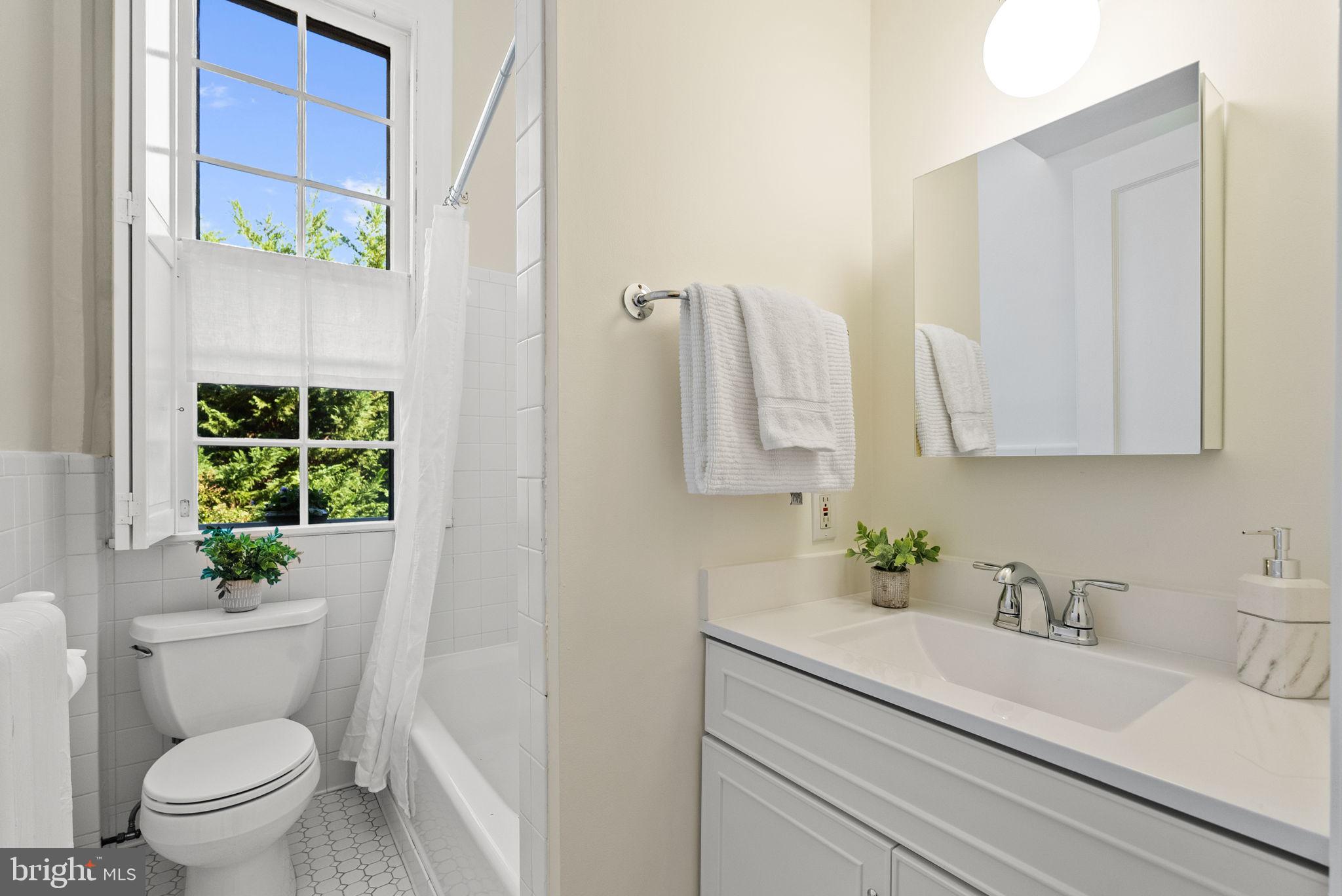 3039 Macomb Street Northwest, Unit 35 Washington, DC 20008 - Photo 35 of 50 Refreshed bathroom with new vanity