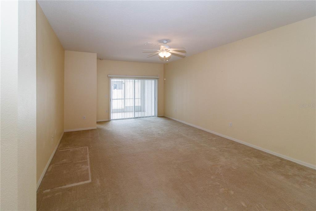1747 Ravenridge Street Wesley Chapel, FL 33543 - Photo 12 of 35 an empty room with a empty space and windows