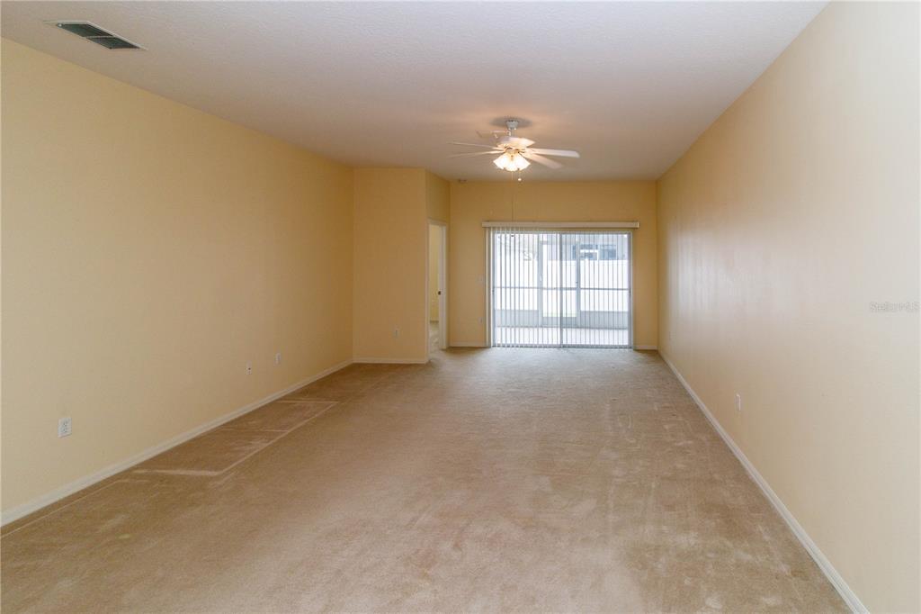 1747 Ravenridge Street Wesley Chapel, FL 33543 - Photo 19 of 35 an empty room with windows and closet