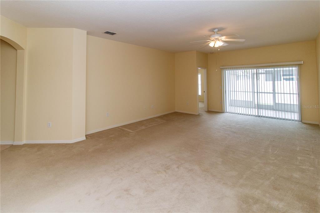 1747 Ravenridge Street Wesley Chapel, FL 33543 - Photo 20 of 35 a view of an empty room with a window