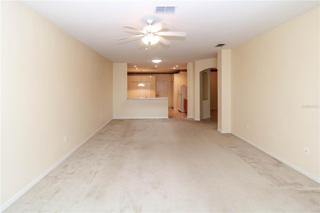 1747 Ravenridge Street Wesley Chapel, FL 33543 - Photo 21 of 35 an empty room with a ceiling fan and a window