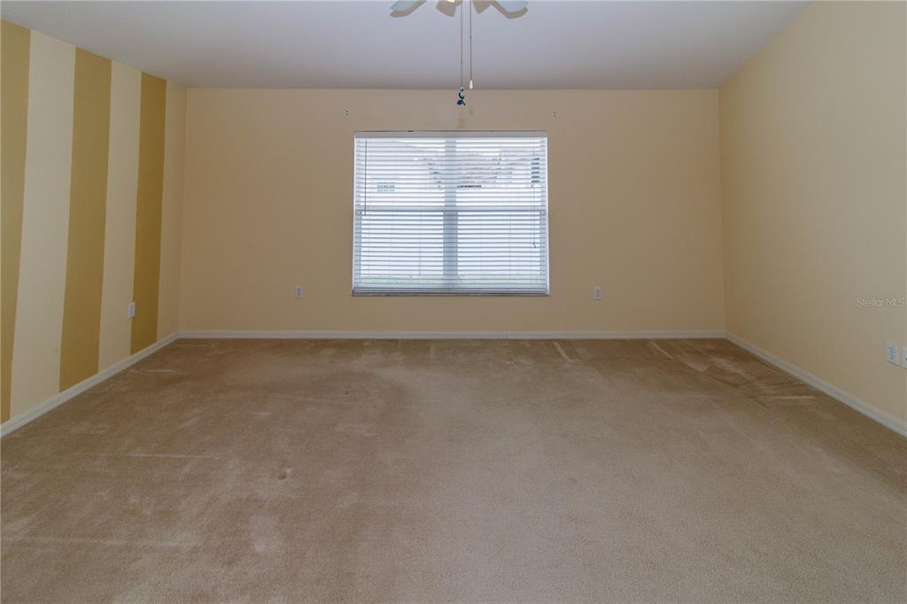 1747 Ravenridge Street Wesley Chapel, FL 33543 - Photo 30 of 35 an empty room with windows and closet