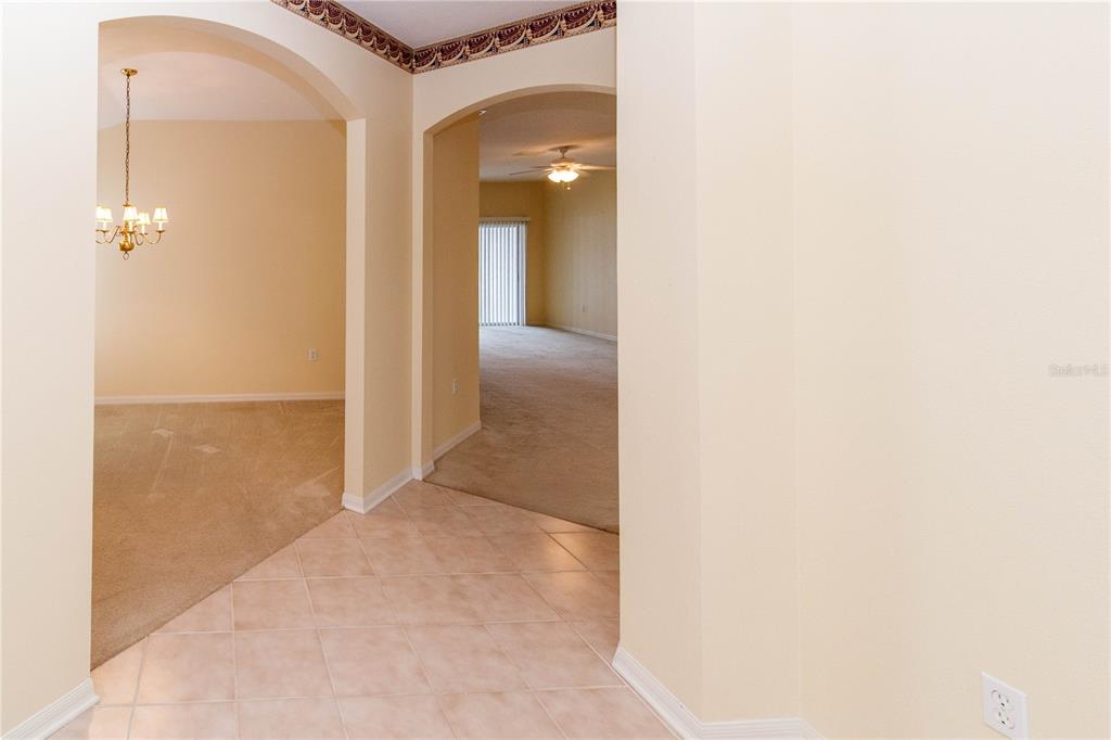 1747 Ravenridge Street Wesley Chapel, FL 33543 - Photo 3 of 35 a view of a hallway with wooden floor