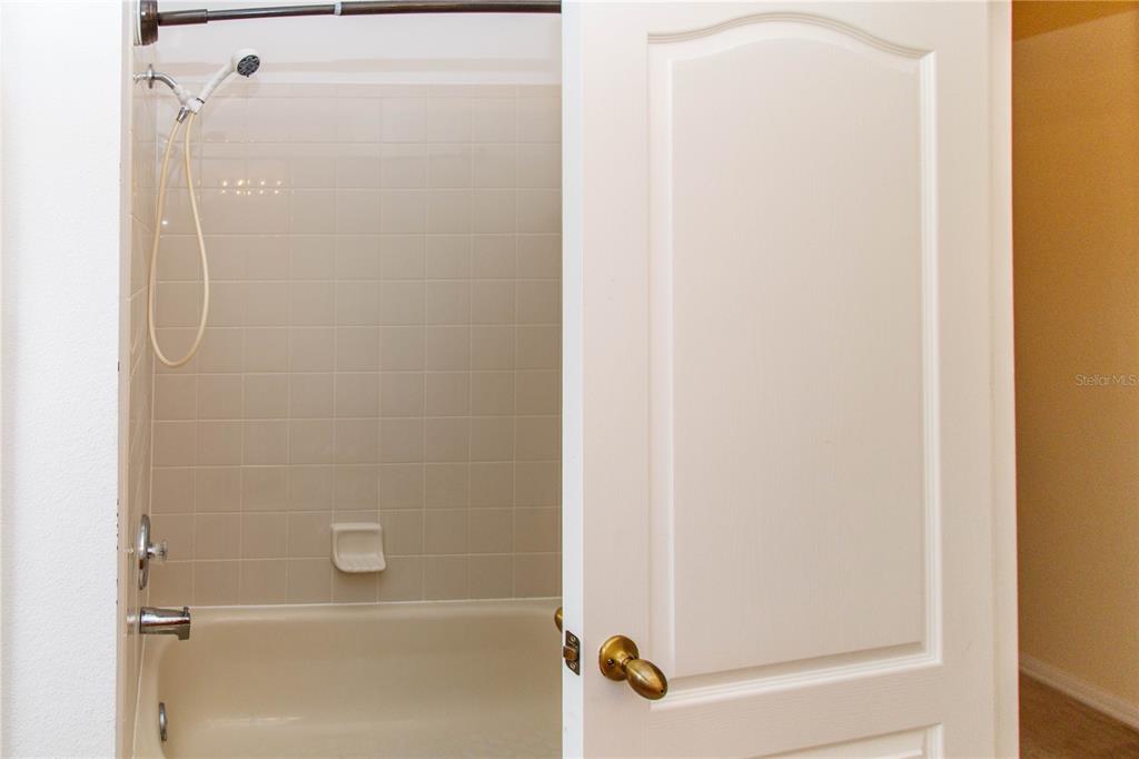 1747 Ravenridge Street Wesley Chapel, FL 33543 - Photo 8 of 35 a bathroom with a shower