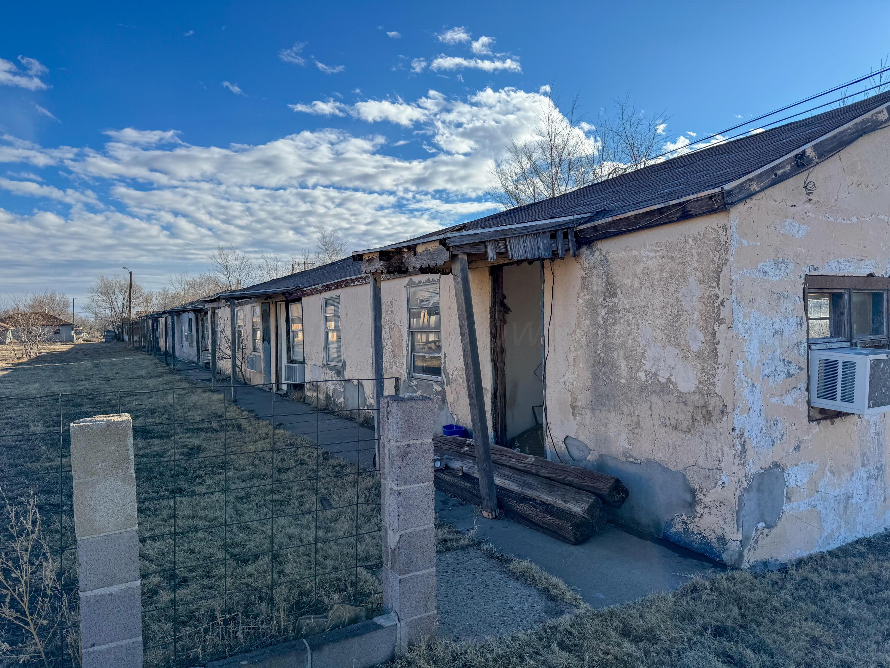 808 West 7th Street Dalhart, TX 79022 - Photo 4 of 14 a backyard of a house with table and chairs