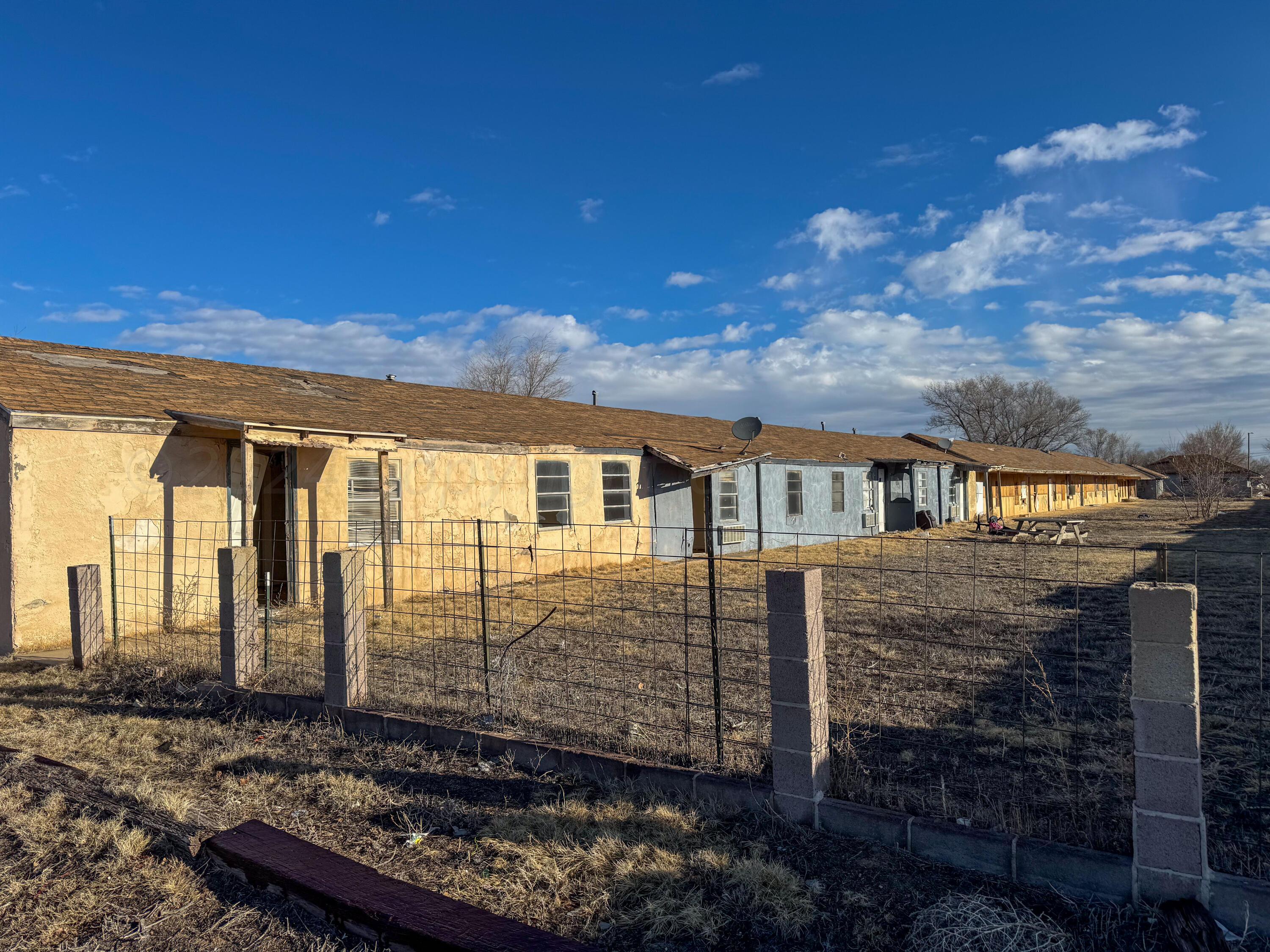 808 West 7th Street Dalhart, TX 79022 - Photo 5 of 14 a front view of a house with a yard