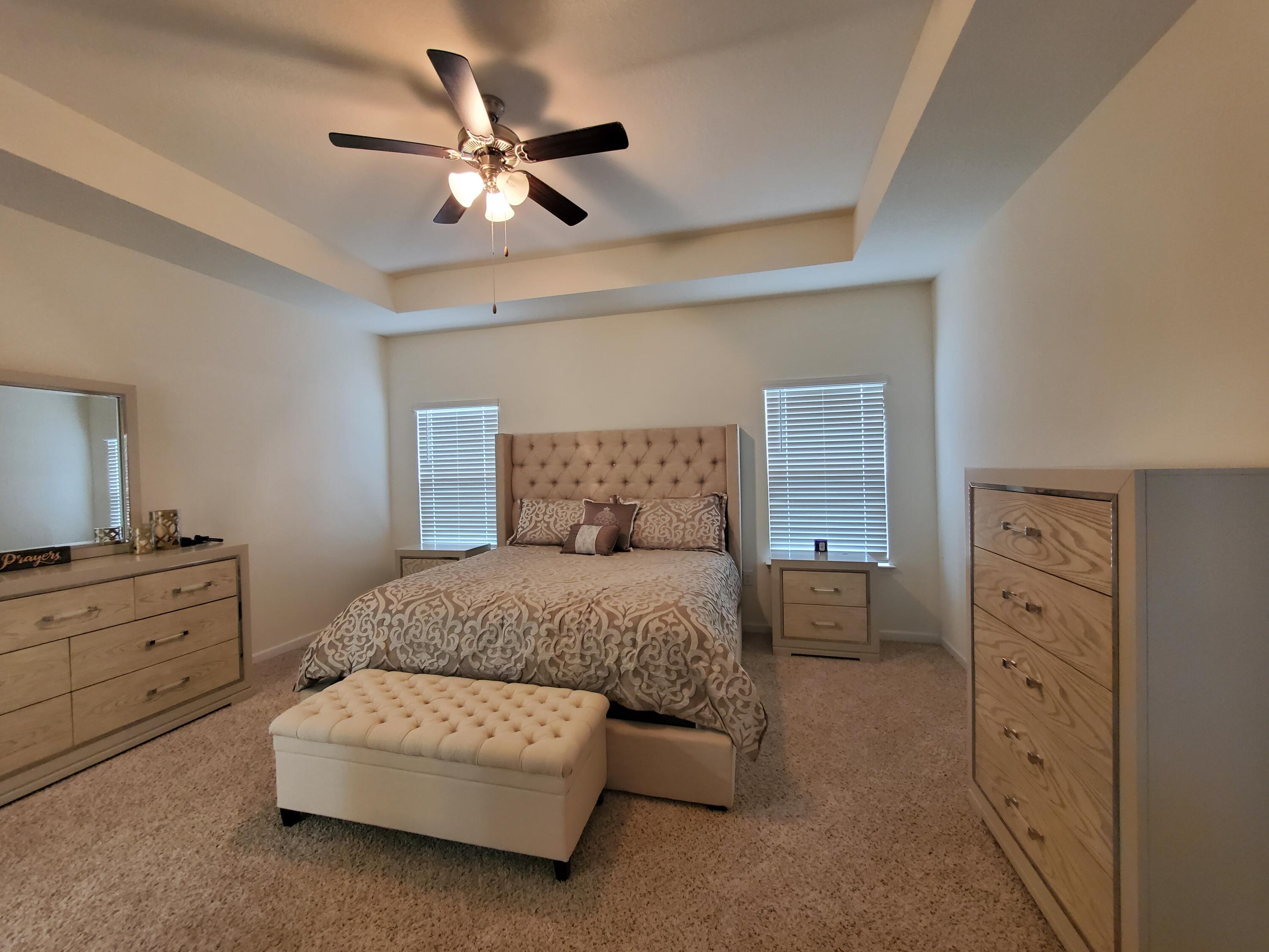 329 Merlin Court Crestview, FL 32539 - Photo 13 of 35 a living room with furniture and a dresser