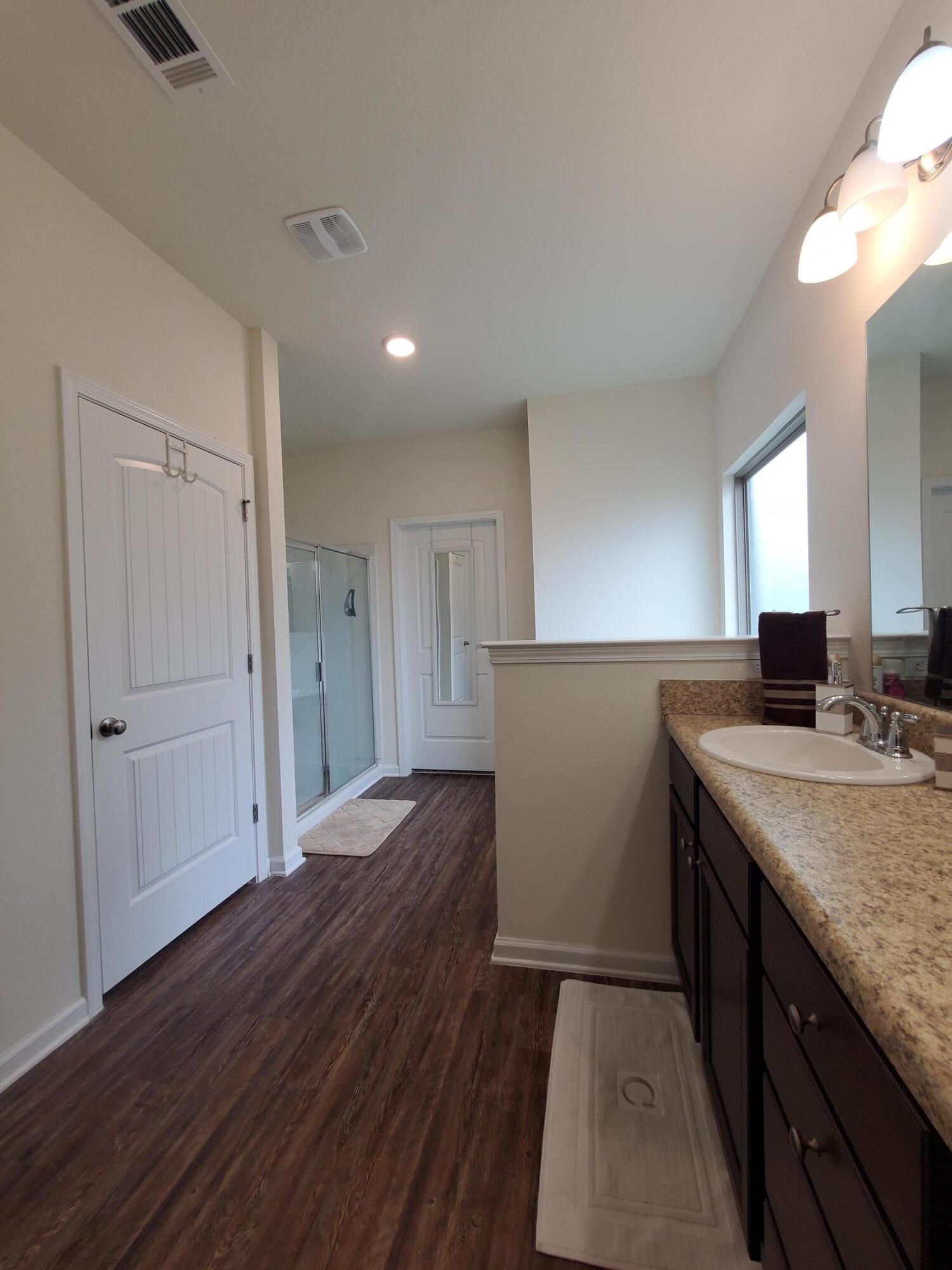 329 Merlin Court Crestview, FL 32539 - Photo 14 of 35 a kitchen with a refrigerator and a sink