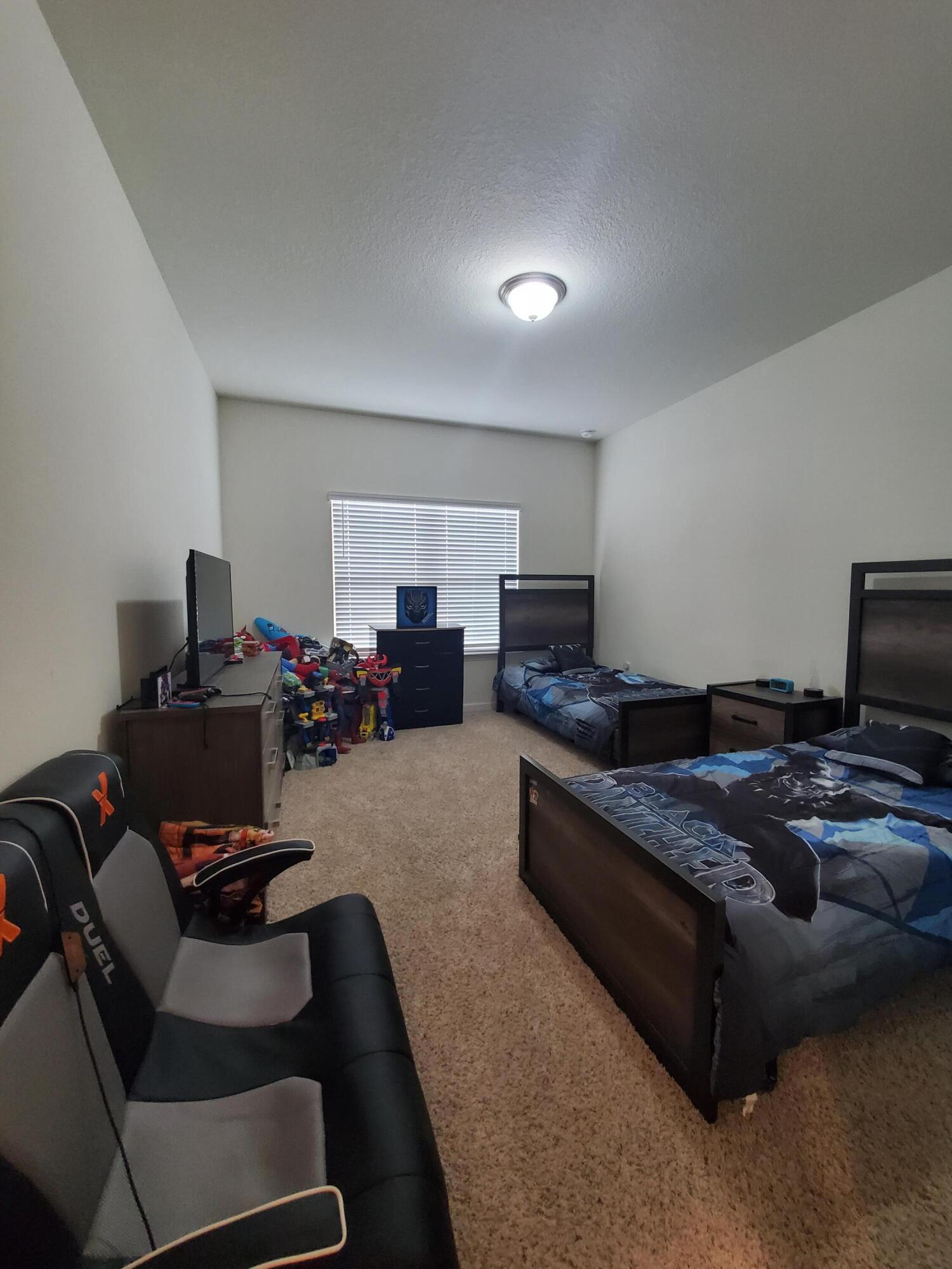 329 Merlin Court Crestview, FL 32539 - Photo 20 of 35 a living room with furniture and a flat screen tv