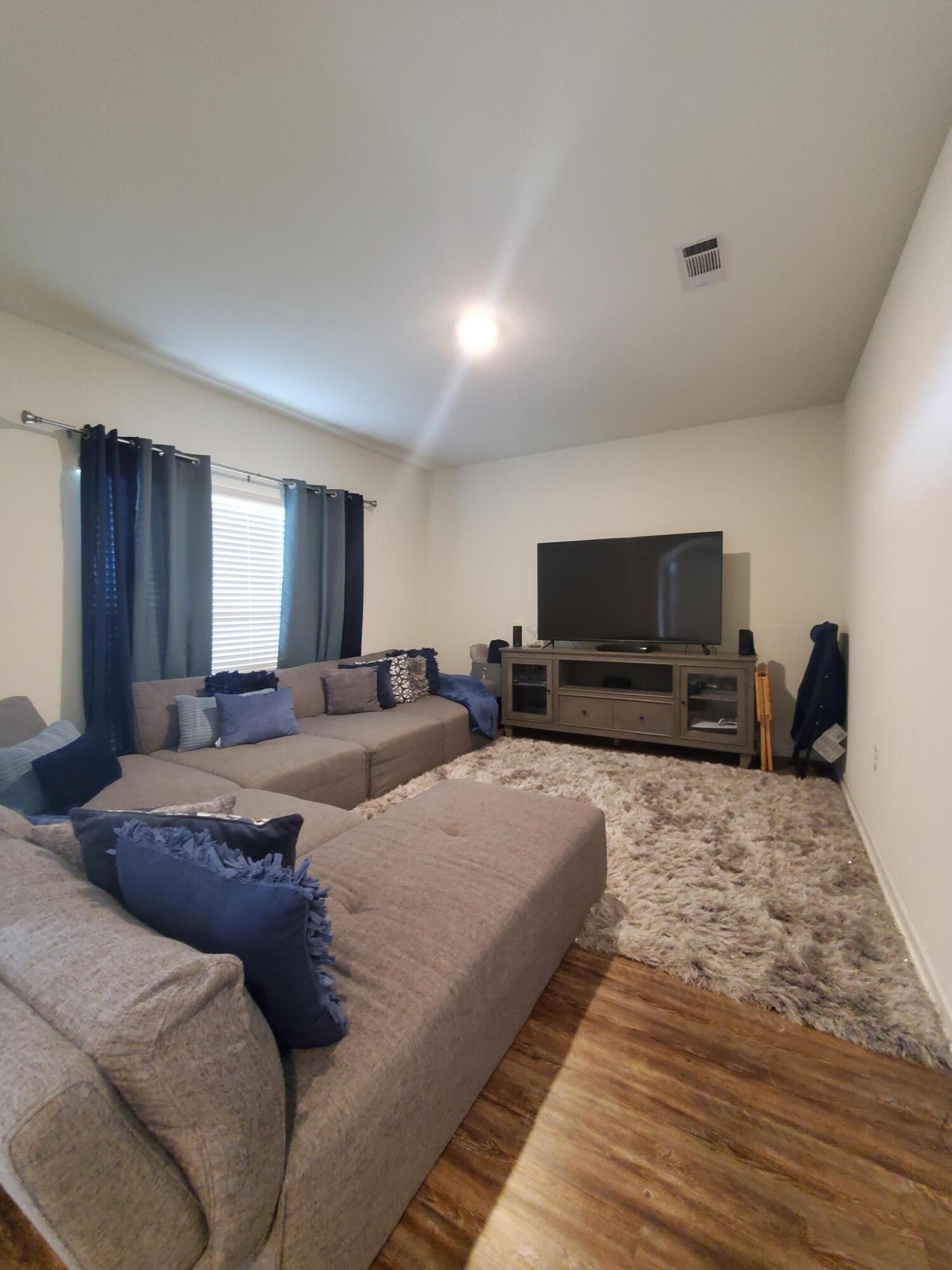 329 Merlin Court Crestview, FL 32539 - Photo 25 of 35 a living room with furniture and a flat screen tv