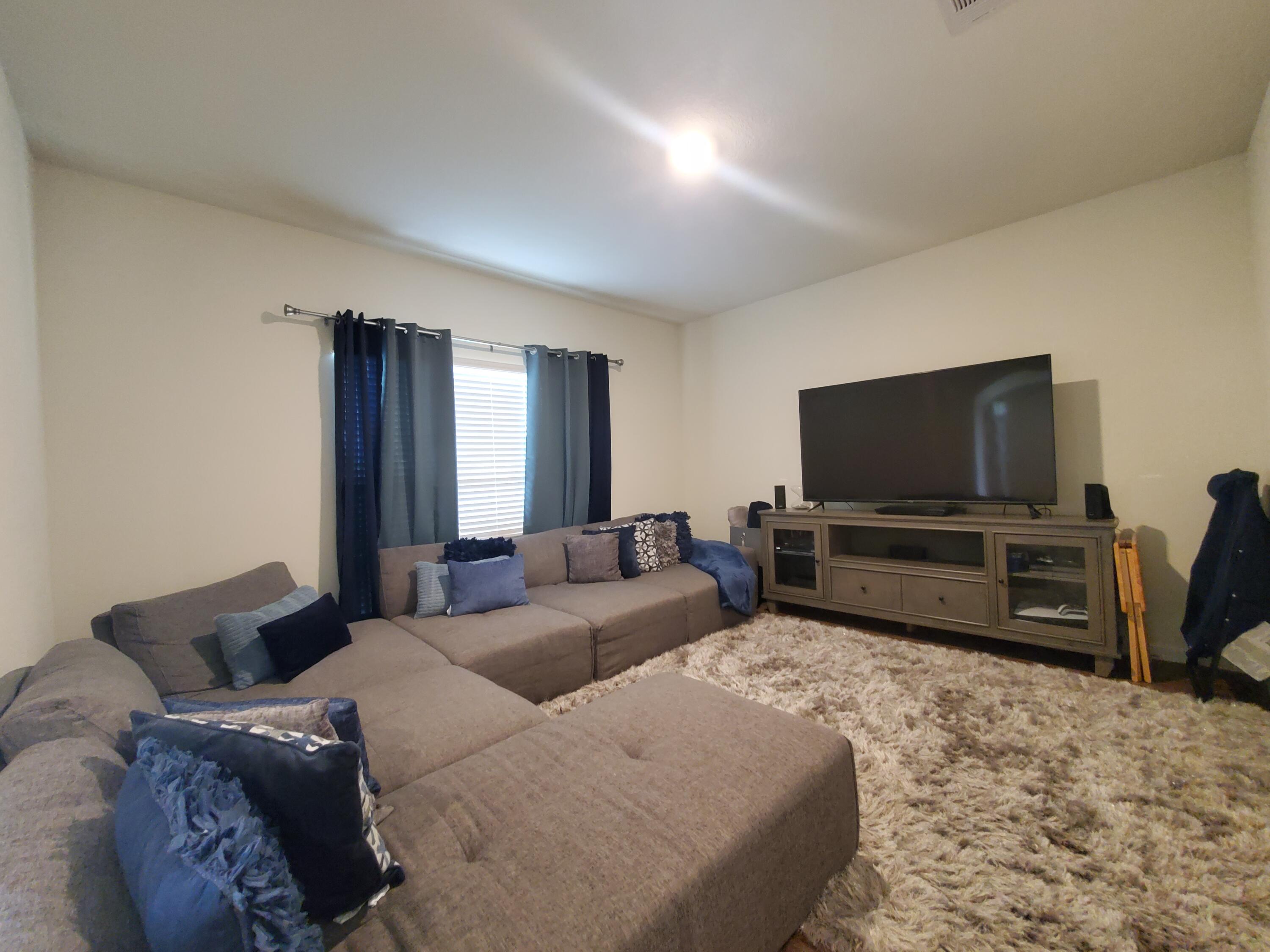 329 Merlin Court Crestview, FL 32539 - Photo 26 of 35 a living room with furniture and a flat screen tv