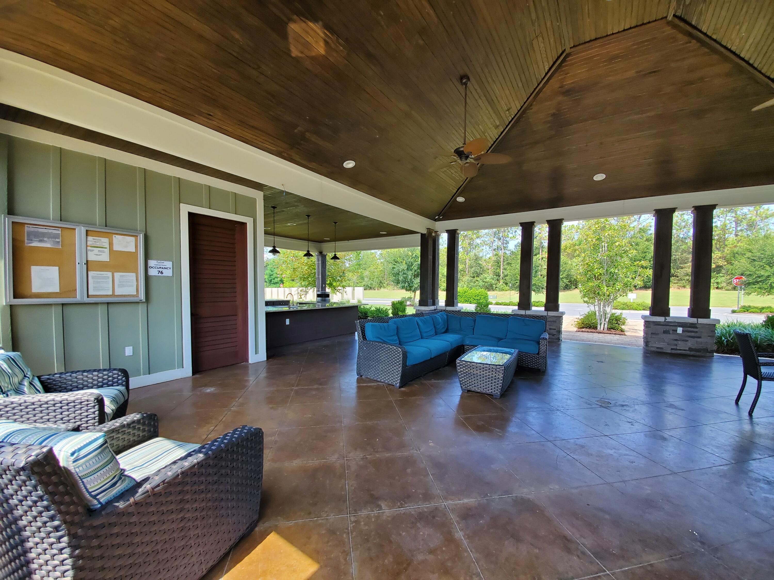 329 Merlin Court Crestview, FL 32539 - Photo 34 of 35 a lobby with furniture and a floor to ceiling window
