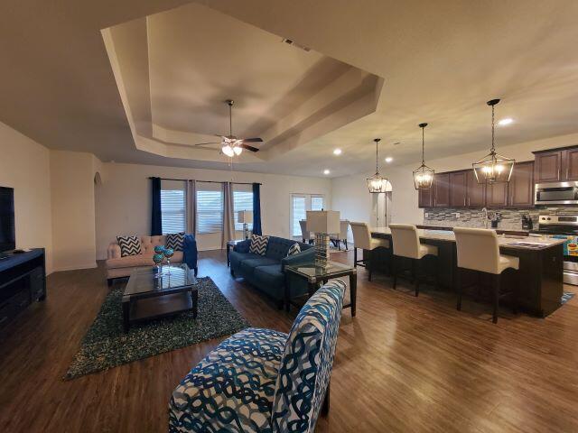 329 Merlin Court Crestview, FL 32539 - Photo 8 of 35 a living room with lots of furniture and kitchen view