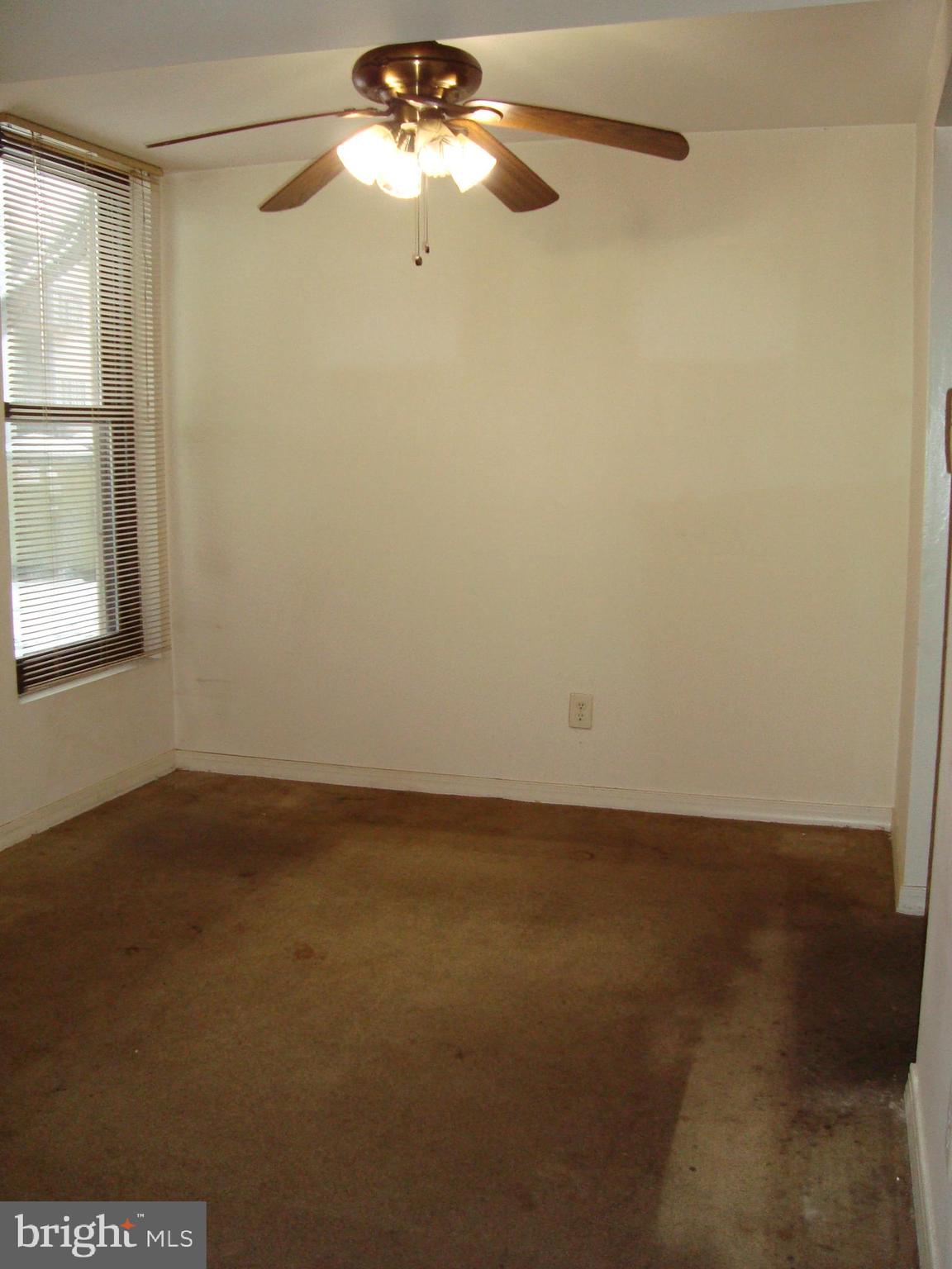 130 Duvall Lane, Unit 187T3 Gaithersburg, MD 20877 - Photo 8 of 19 an empty room with a window and a fan