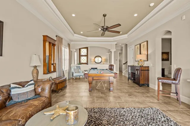 a spacious bedroom with a bed and flat screen tv