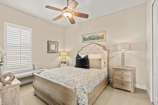 a view of a dining room with furniture and a chandelier