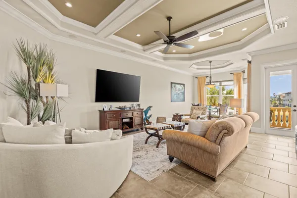 a large kitchen with kitchen island a large counter top space a sink stainless steel appliances and cabinets