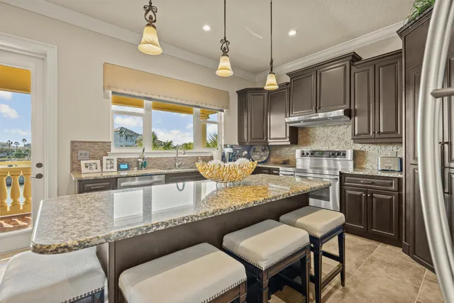 a dining room with furniture and a chandelier