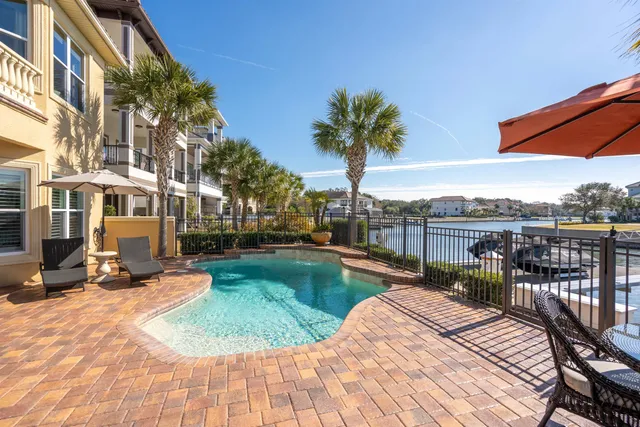 an aerial view of a house with swimming pool