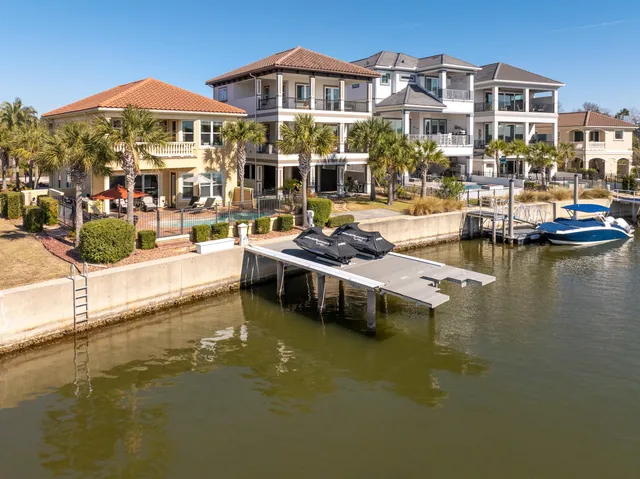 a view of a swimming pool with outdoor seating