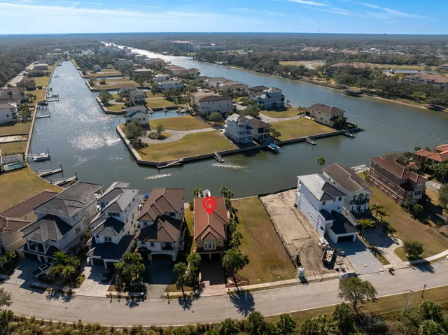 an aerial view of a house with a ocean view