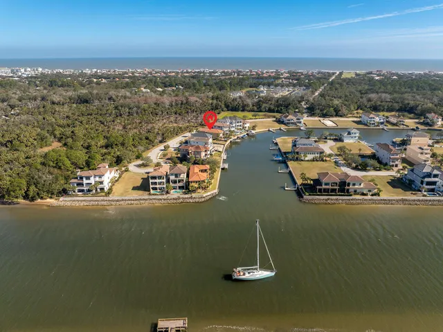 an aerial view of a house with a ocean view