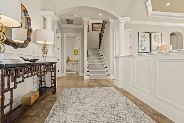 a room with furniture pool table and windows