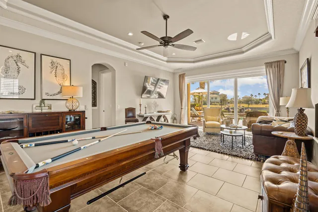 a living room with furniture a rug and a window