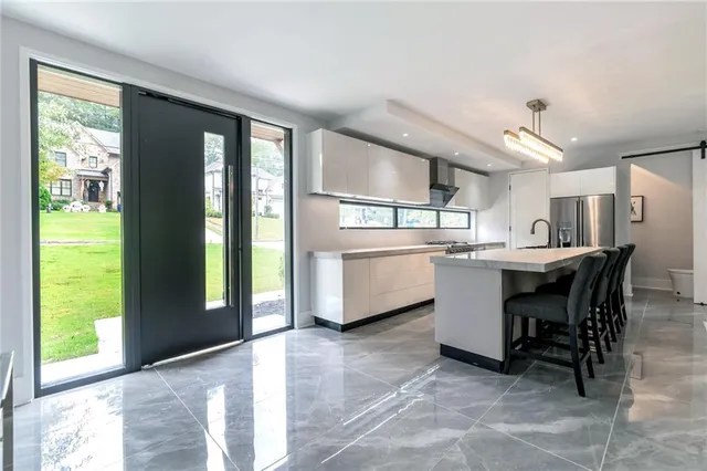 a kitchen with a sink a counter top space and appliances