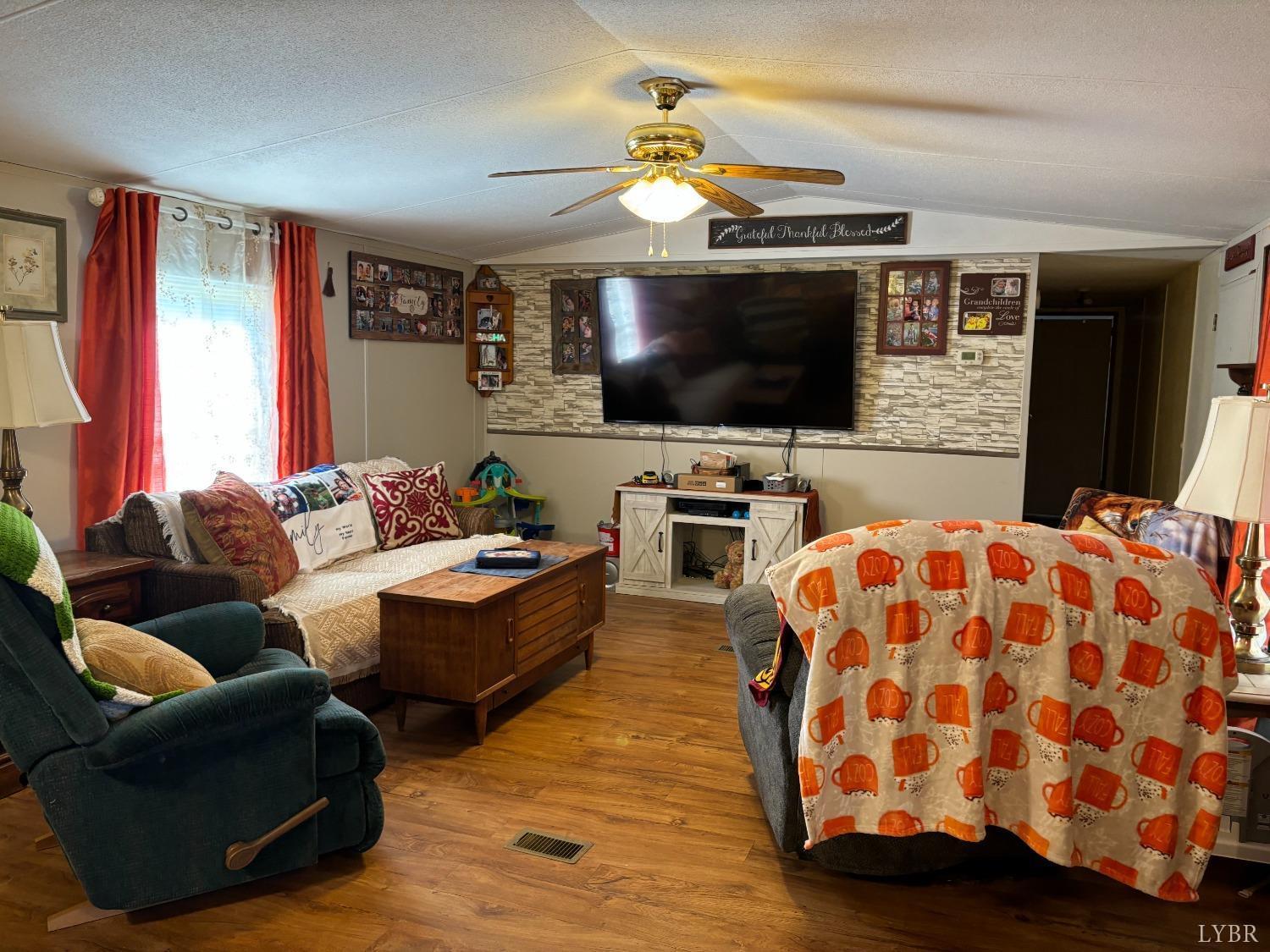 168 Victoria Drive Amherst, VA 24521 - Photo 6 of 9 a living room with furniture and a flat screen tv