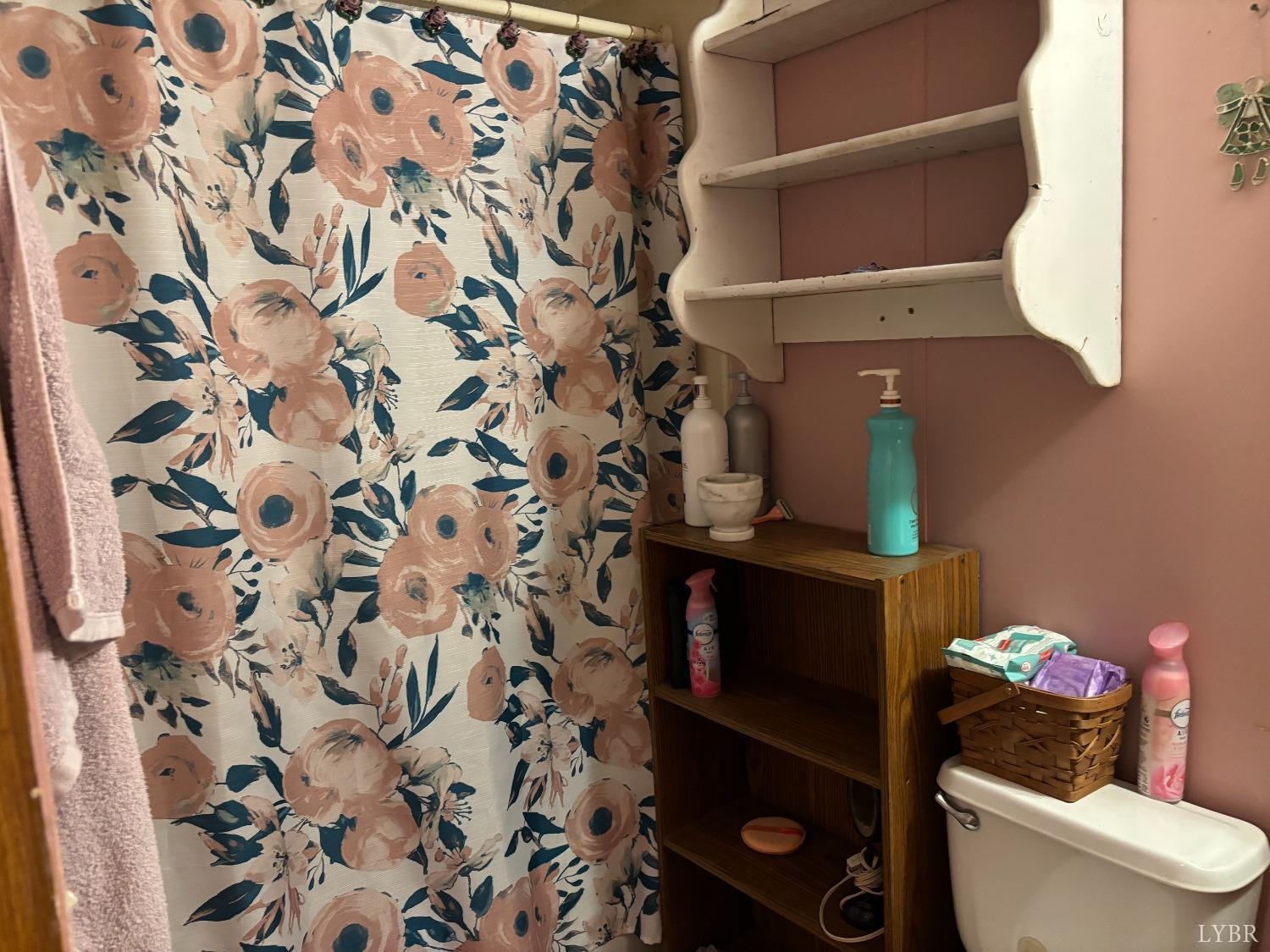 168 Victoria Drive Amherst, VA 24521 - Photo 7 of 9 a bathroom with a toilet and a shower curtain