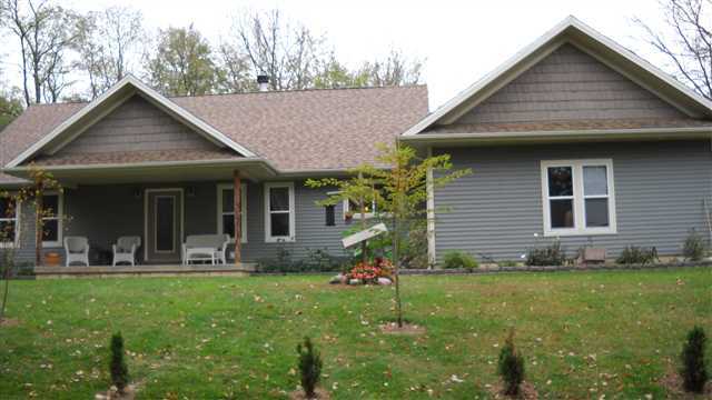 18567 North 50th Road East Danvers, IL 61732 - Photo 1 of 1 a front view of house with yard and outdoor seating