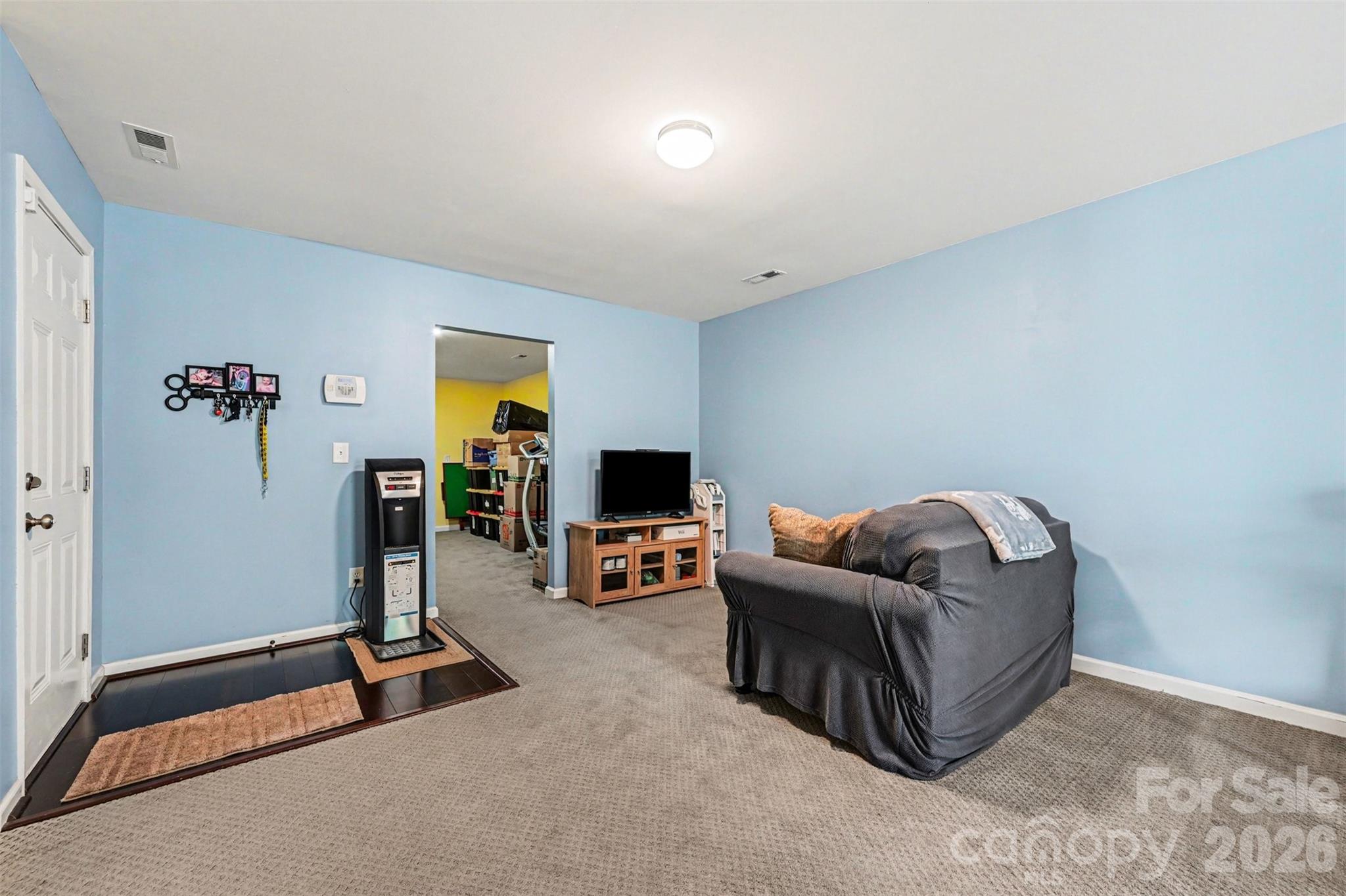 391 Lone Tree Lane Clover, SC 29710 - Photo 19 of 27 a living room with furniture and a flat screen tv