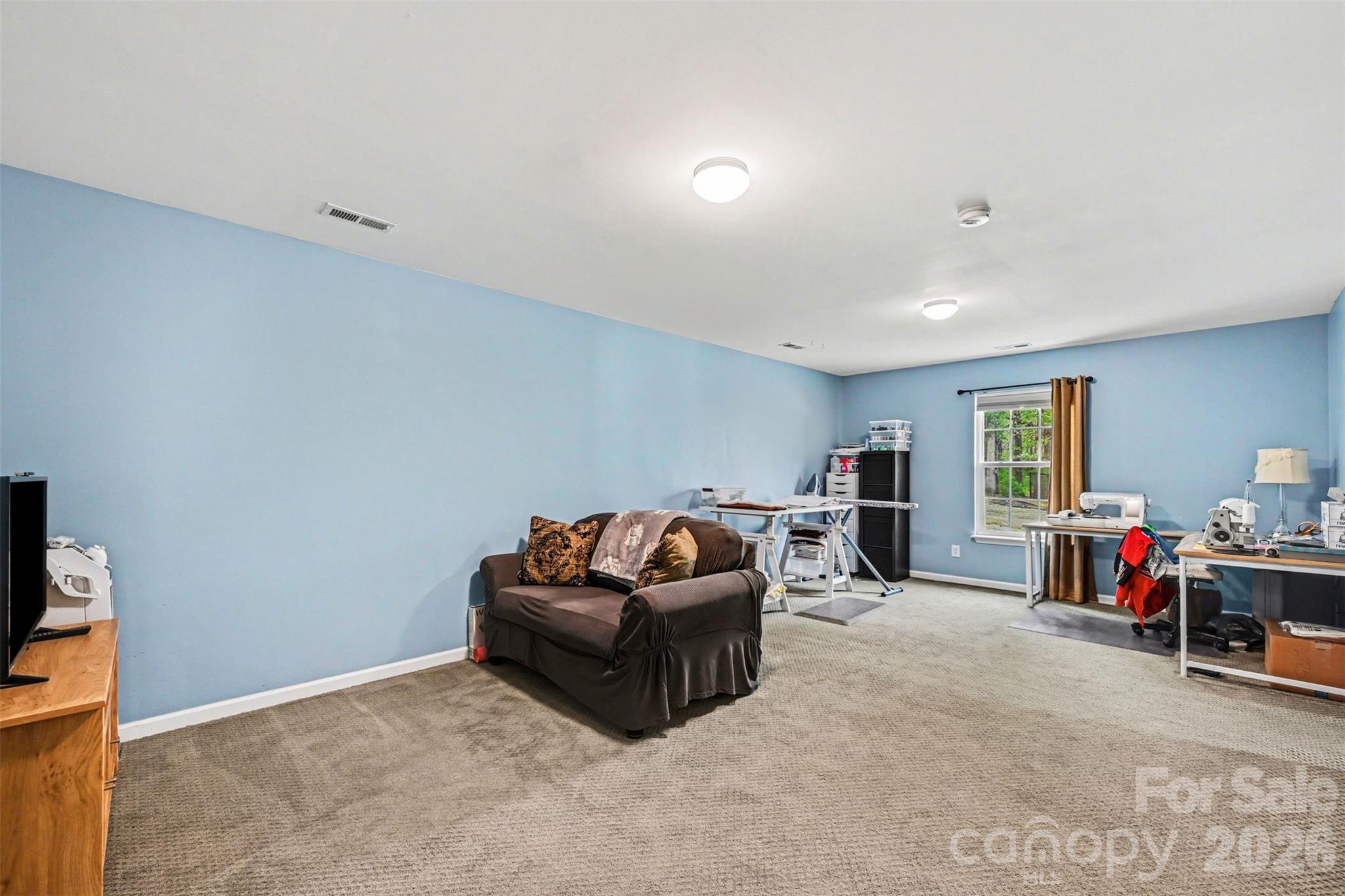 391 Lone Tree Lane Clover, SC 29710 - Photo 20 of 27 a living room with furniture and a flat screen tv