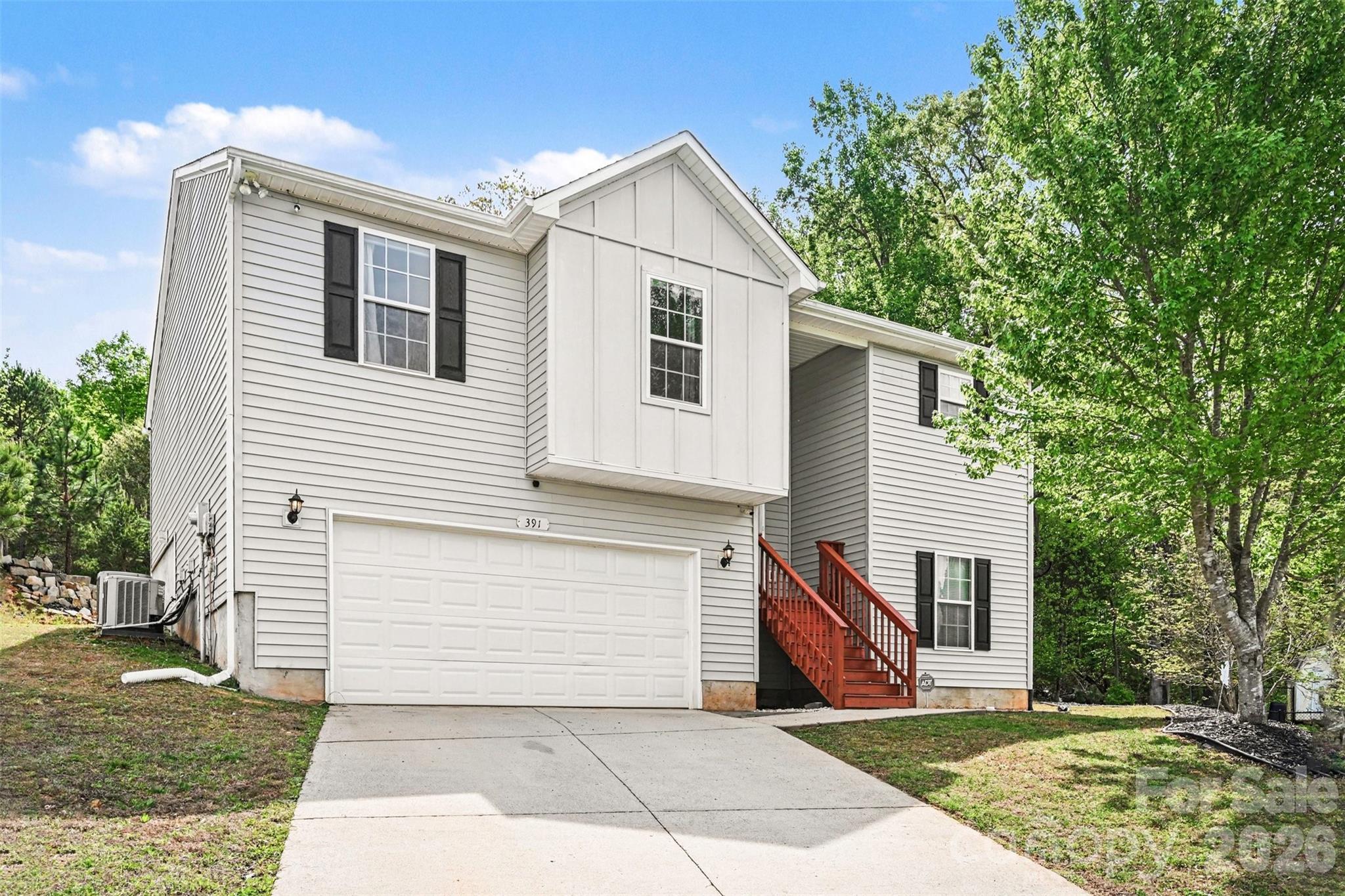 391 Lone Tree Lane Clover, SC 29710 - Photo 2 of 27 a front view of a house with a yard