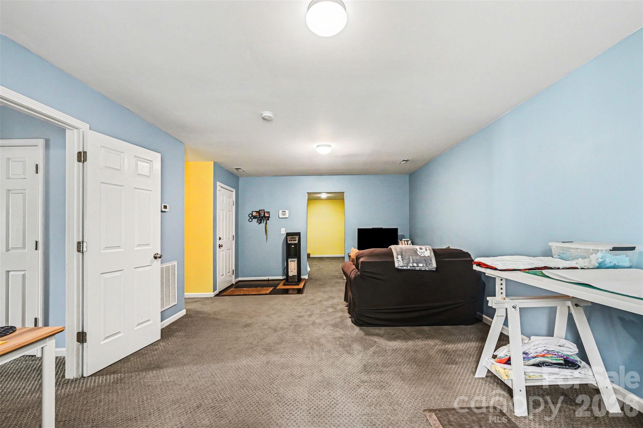 391 Lone Tree Lane Clover, SC 29710 - Photo 21 of 27 a living room with a couch and dresser with wooden floor