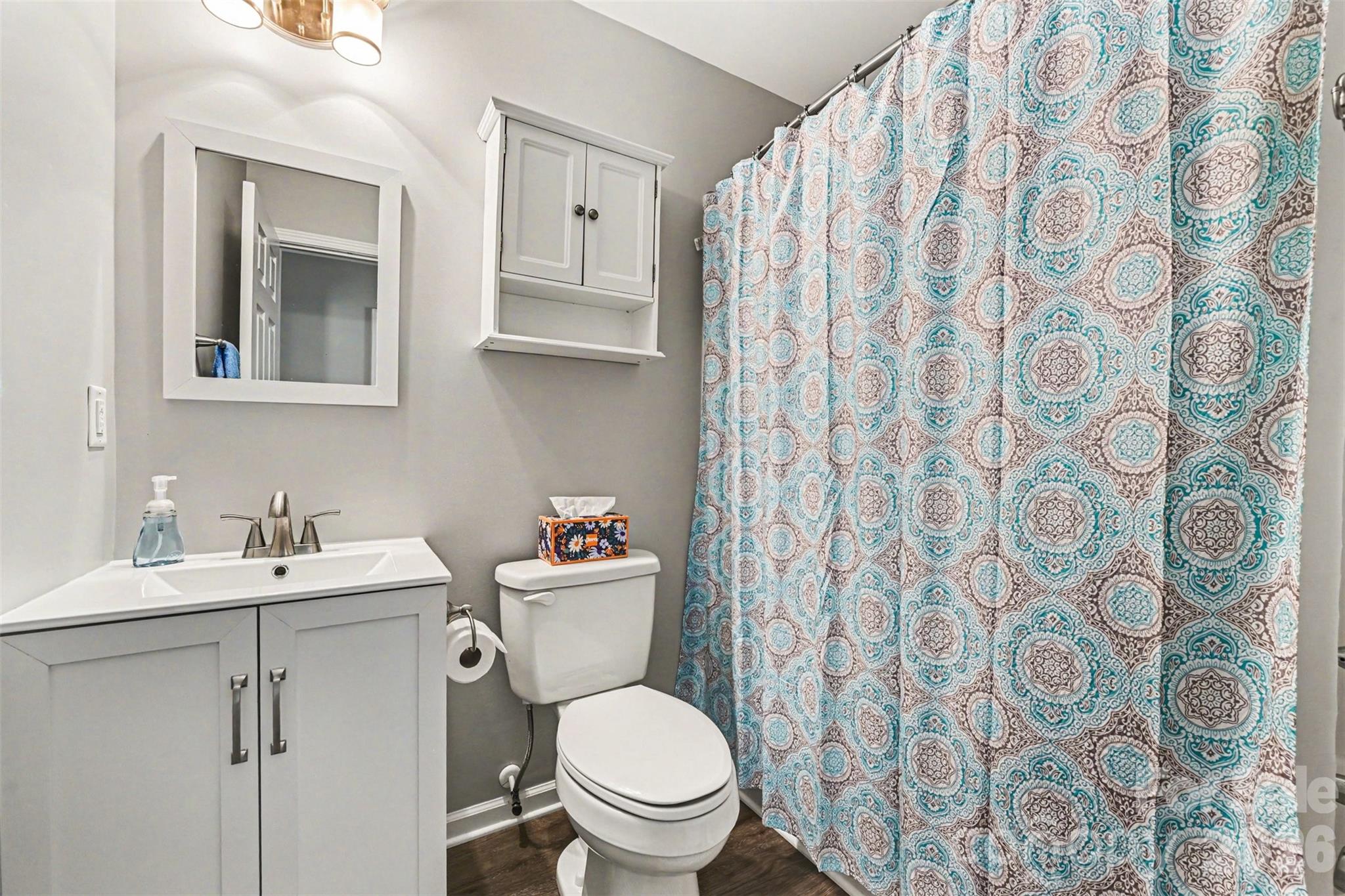 391 Lone Tree Lane Clover, SC 29710 - Photo 22 of 27 a bathroom with a toilet sink and mirror