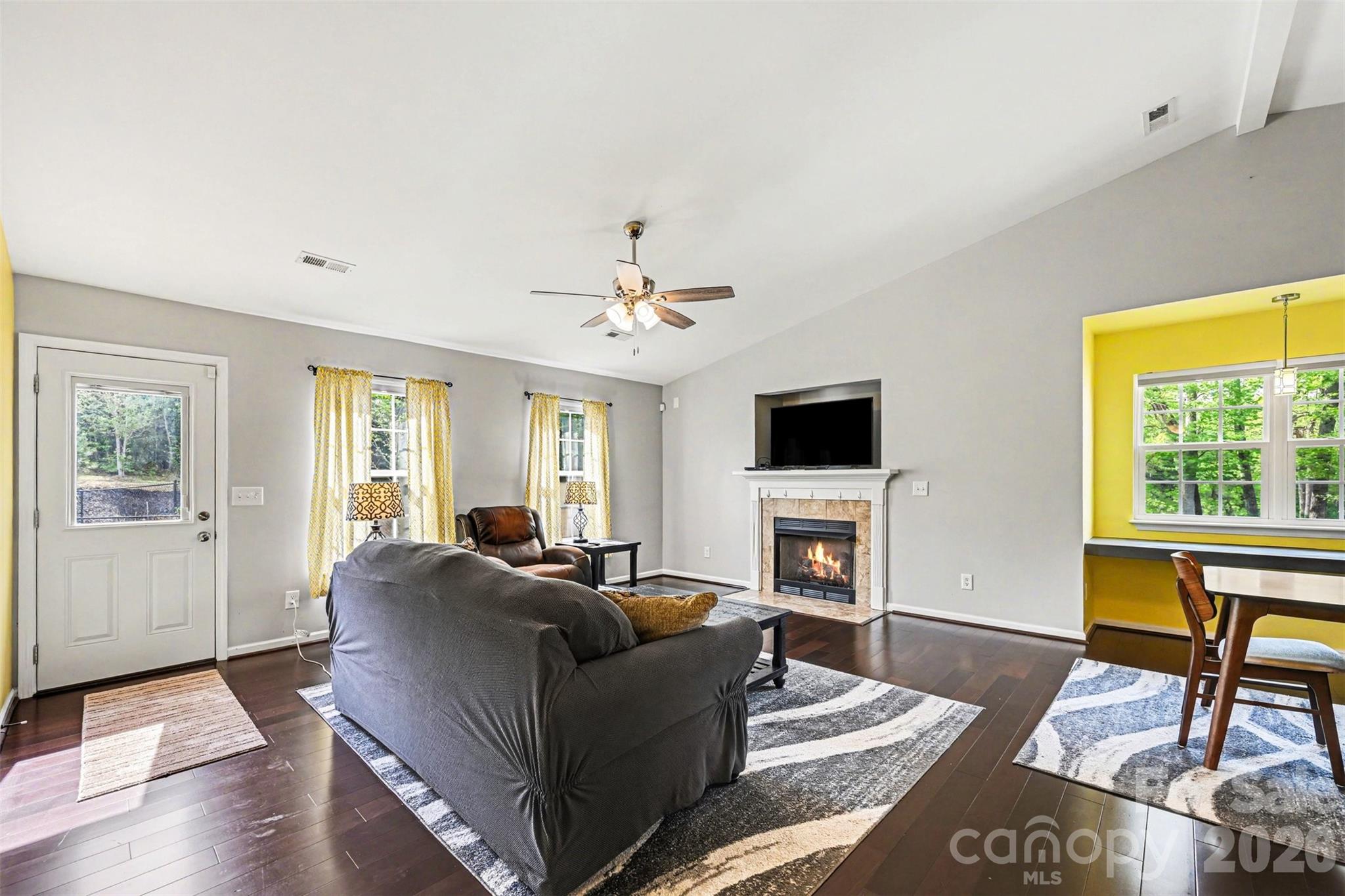 391 Lone Tree Lane Clover, SC 29710 - Photo 4 of 27 a living room with furniture a fireplace and a flat screen tv