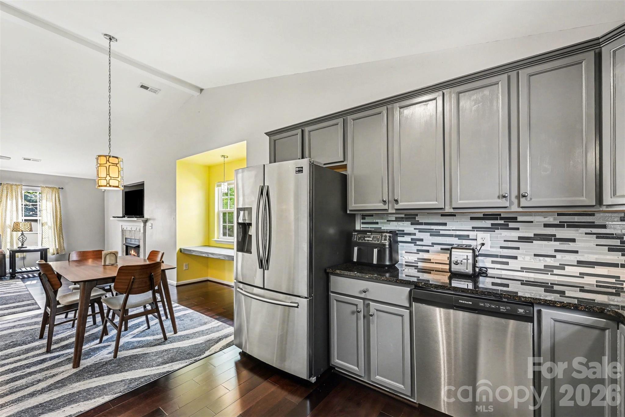 391 Lone Tree Lane Clover, SC 29710 - Photo 8 of 27 a kitchen with stainless steel appliances granite countertop a refrigerator a sink a stove and white cabinets