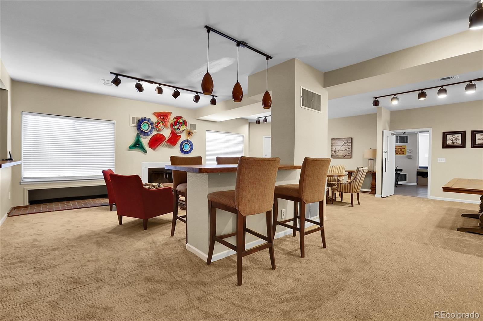 2301 East Fremont Avenue, Unit U05 Centennial, CO 80122 - Photo 25 of 33 a living room with furniture and a window