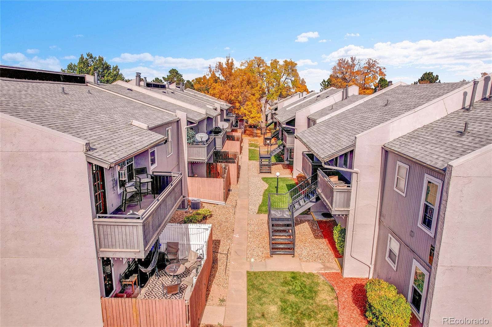 2301 East Fremont Avenue, Unit U05 Centennial, CO 80122 - Photo 26 of 33 an aerial view of multiple houses with yard