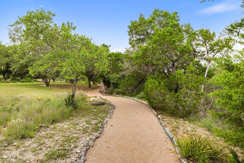 701 Hurst Creek Road Lakeway, TX 78734 - Photo 32 of 37 Take a peaceful stroll on the neighborhood Private Trail behind the home that will also lead you to the water, kayak & canoe storage & private day dock.
