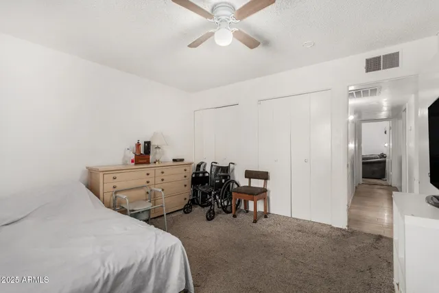 a bed room with a bed and furniture